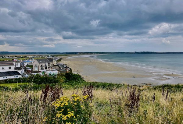 a view of a beach from a hill