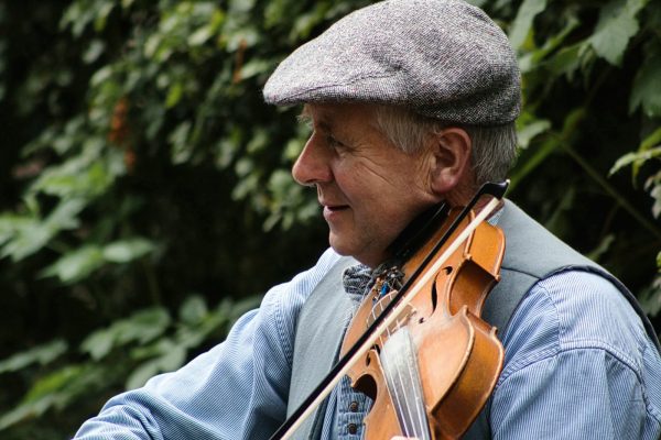 a man playing a violin